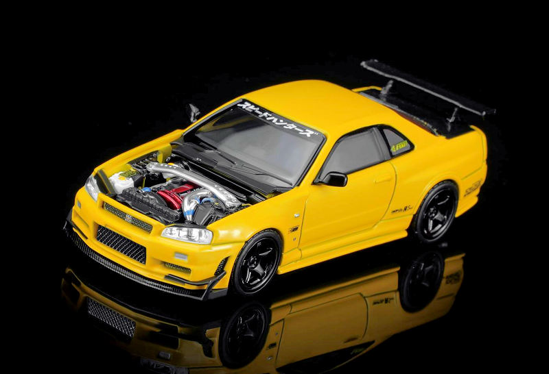 Nissan Skyline GT-R (R34) Customized With GT Aero Kit lightning yellow 1:64 Motorhelix