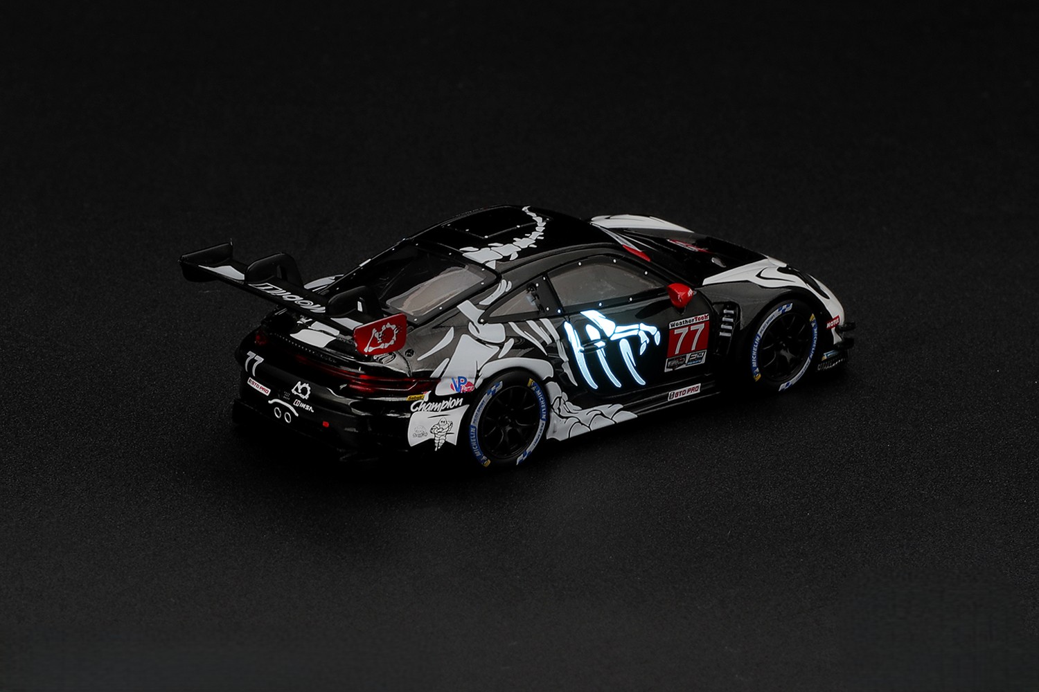 Porsche 911 (992) GT3 AO Racing #77 N.Tandy/H.King/A.Picariello *Skeleton Rexy* IMSA Petit Le Mans 2026 1:64 Mini GT