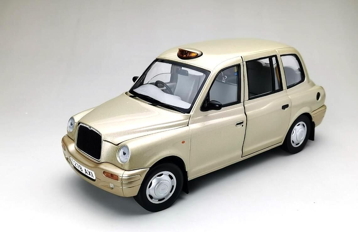 TX1 London Taxi Cab 1998 silver/gold 1:18 Sun Star
