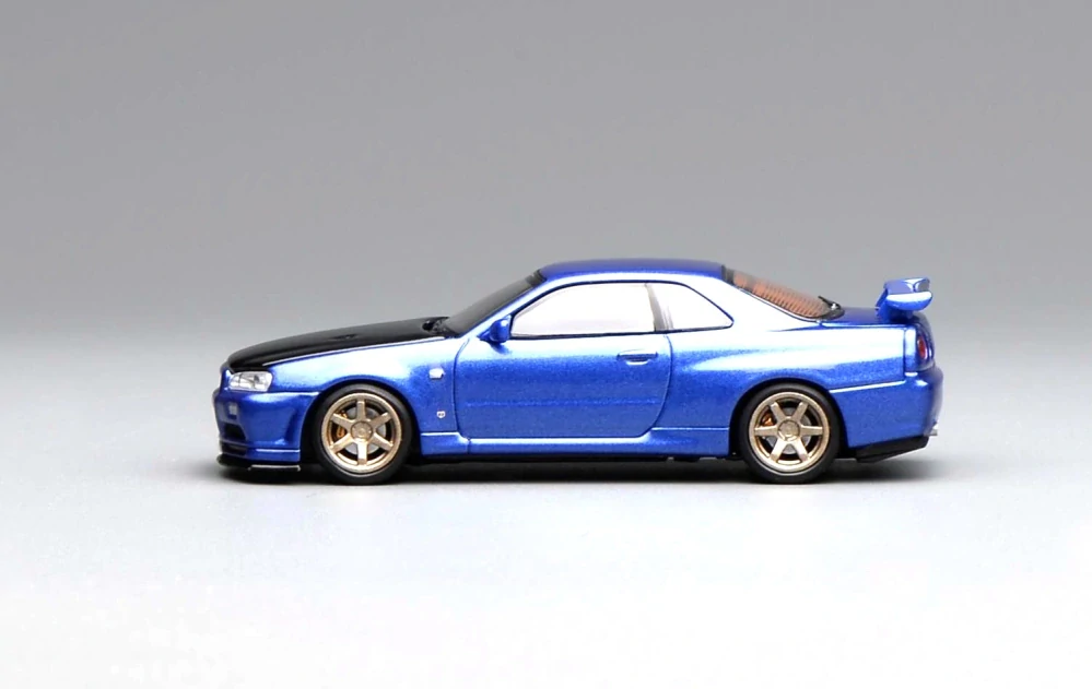 Nissan GT-R (R34) Coupe V-Spec II Costumized 1999 blue/black 1:64 Motorhelix