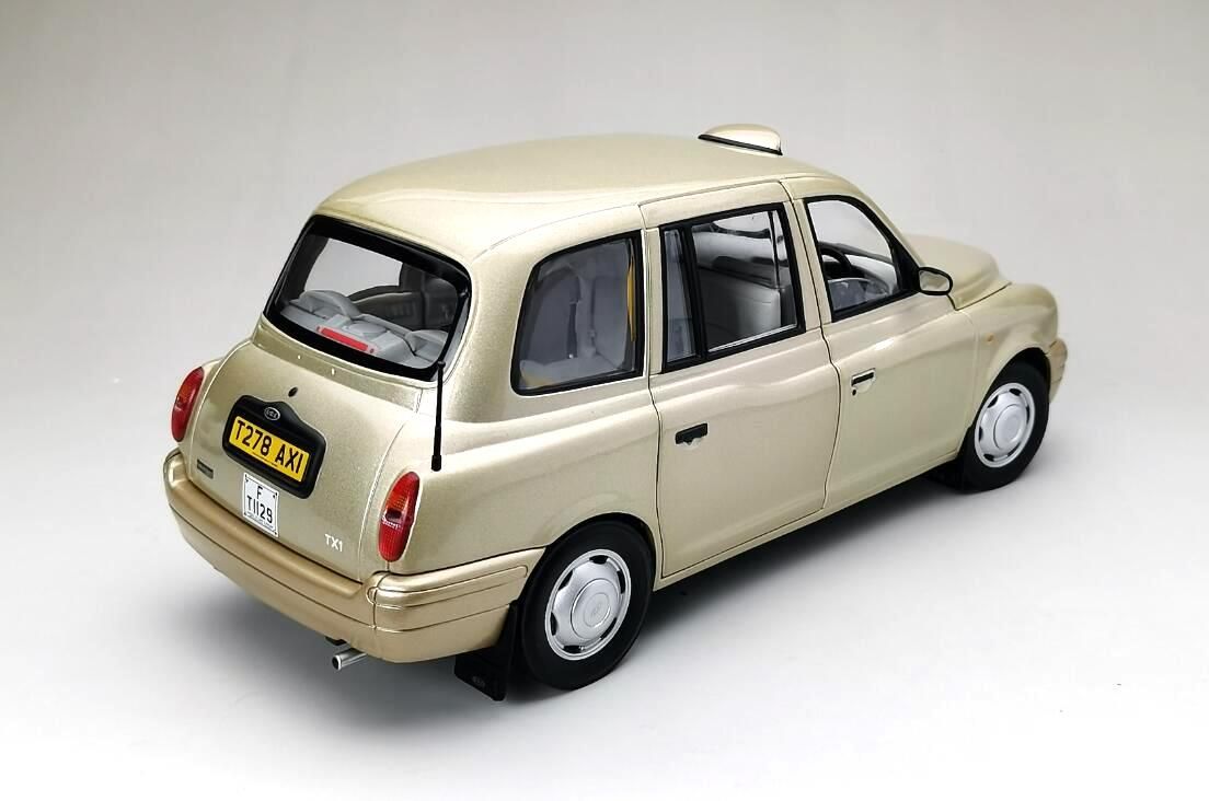 TX1 London Taxi Cab 1998 silver/gold 1:18 Sun Star