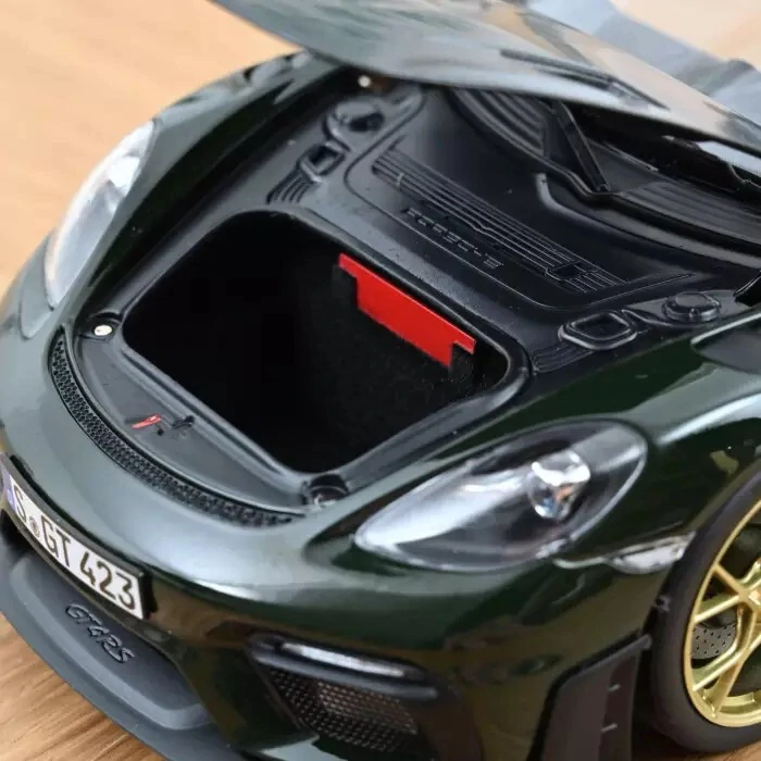 Porsche Cayman GT4 RS with Weissach 2023 brewster green 1:18 Norev