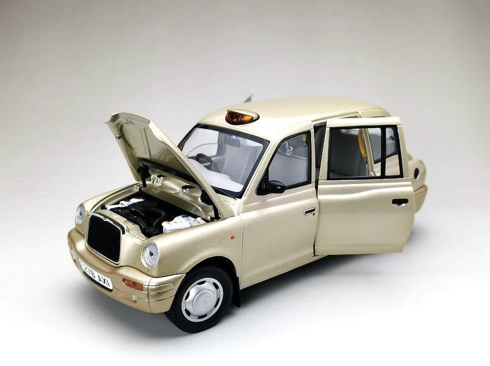 TX1 London Taxi Cab 1998 silver/gold 1:18 Sun Star