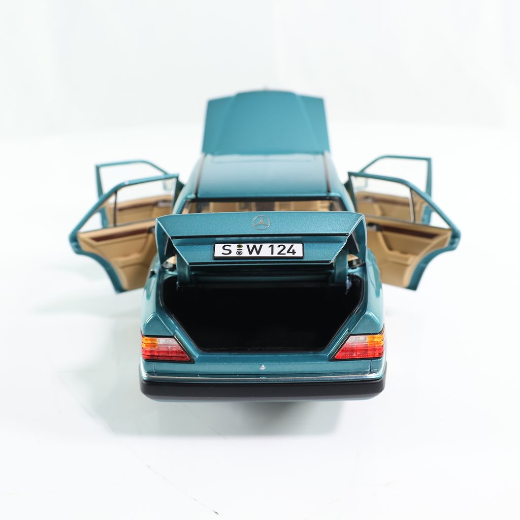 Mercedes-Benz 230 E W124 1989 turquoise metallic 1:18 Norev